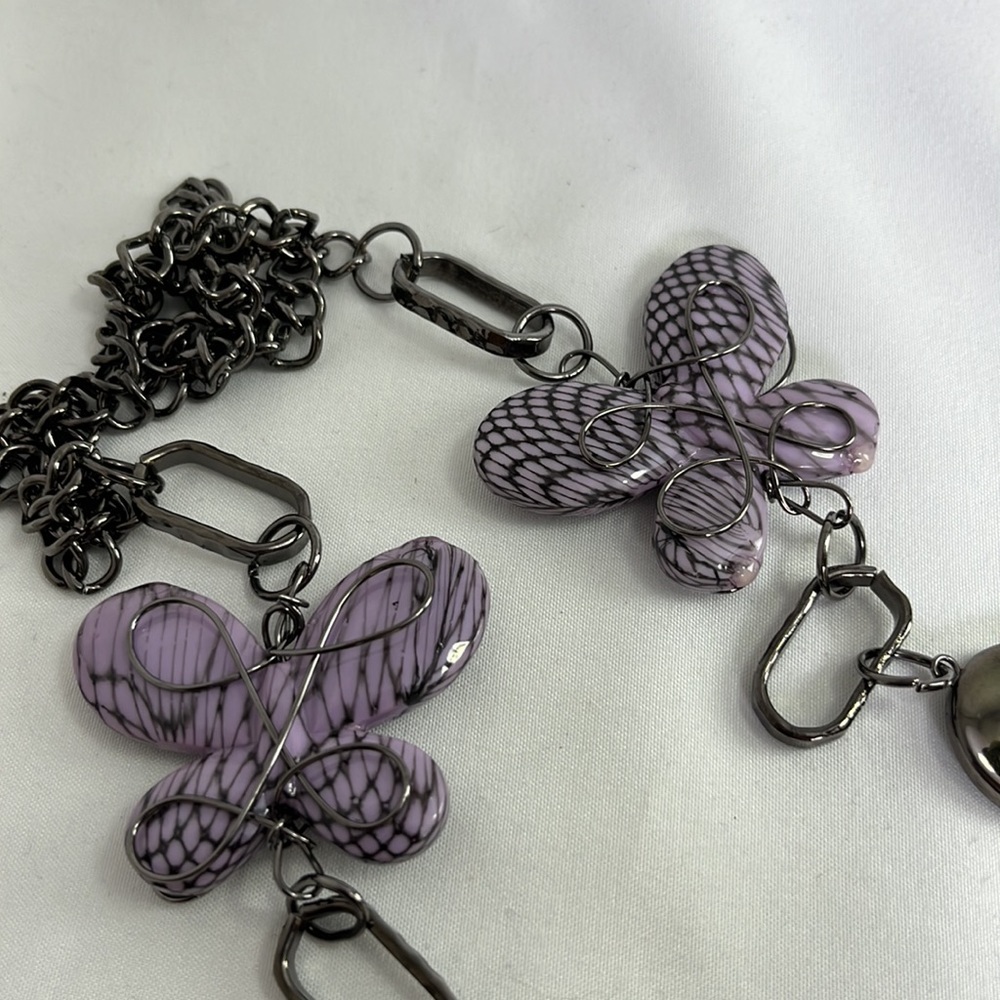Purple Butterfly wire wrapped and black tone metal necklace. 18” long